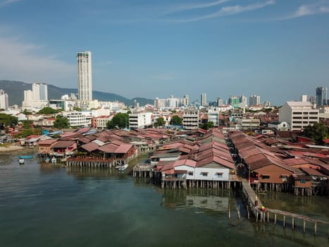 Aerial view rooftop at clan jetty in morning. Background is KOMTAR building.