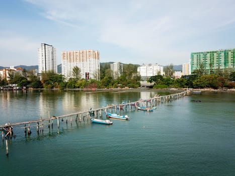 Georgetown, Penang/Malaysia - Mar 17 2020: Wooden bridge jetty at Jelutong.