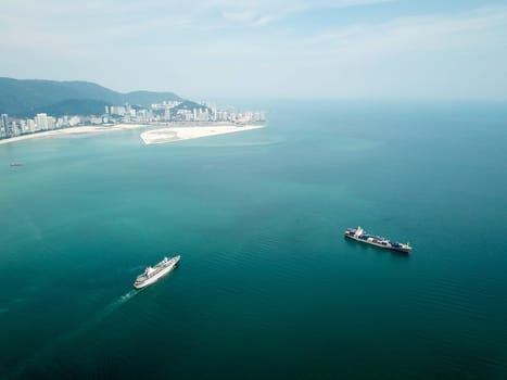 Georgetown, Penang/Malaysia - Mar 17 2020: Cruise ship move at Penang sea. Back is Gurney Wharf reclamation land.
