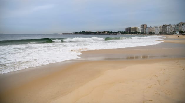 Ocean surf on the beach of Copacabana. Rio de Janeiro, February 2020