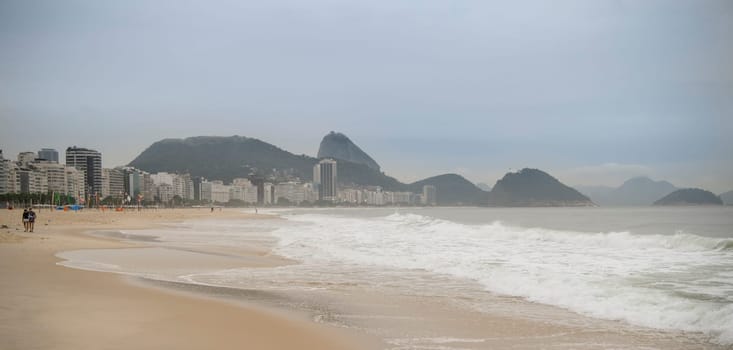 Ocean surf on the beach of Copacabana. Rio de Janeiro, February 2020