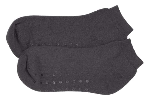 Socks isolated. Closeup of a pair of black warm wool socks for cold winter isolated on a white background. Macro photgraph.