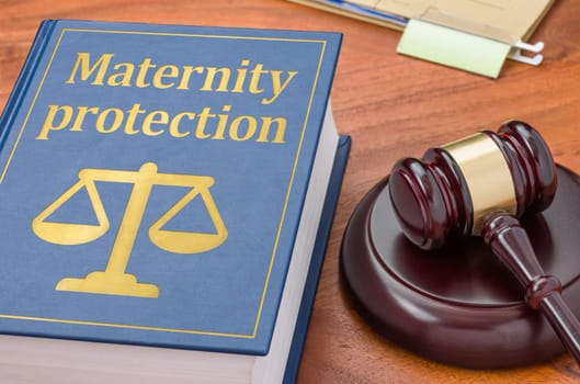 Law book with a gavel - Maternity protection