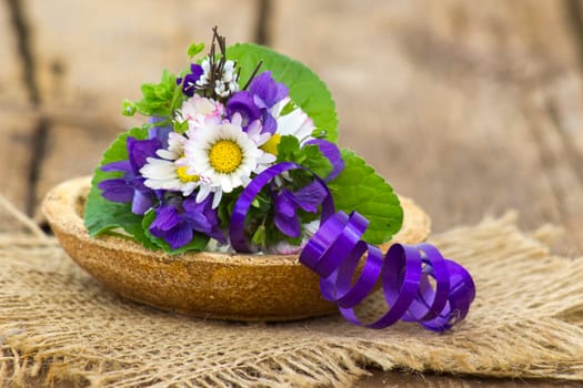 Viola odorata and daisies -  spring flowers bouquet