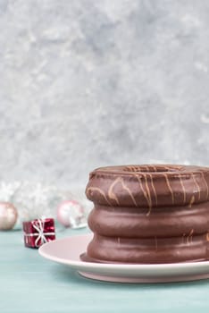 Traditional german christmas chocolate cake called Baumkuchen, winter season sweets