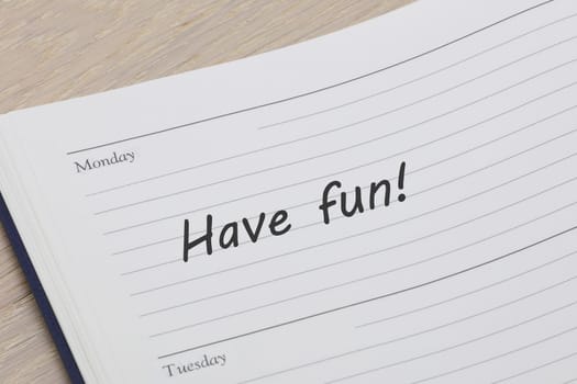 A have fun reminder note in a diary page