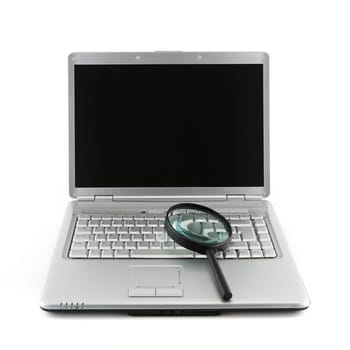 A Laptop PC and magnifying glass indicating data security concept