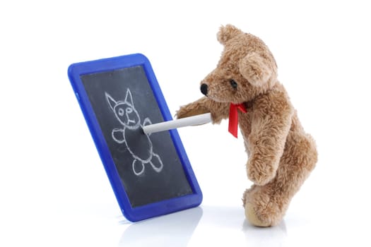 A cute teddy bear drawing on a chalk board