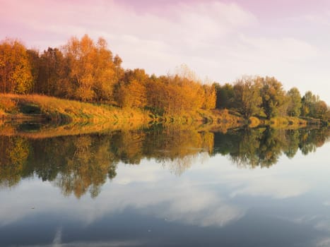 Autumn trees by the water