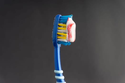Toothbrush closeup on white background. Healthy concept