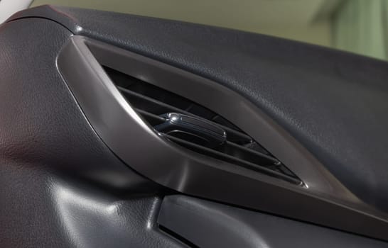 Modern Car Air Vent in Car Interior in Low Angle View