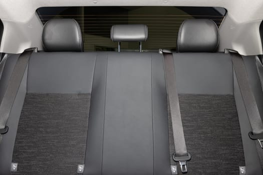 Rear Car Interior Including Gray Car Rear Seat and Rear Window and Safety Belt or Seat Belt