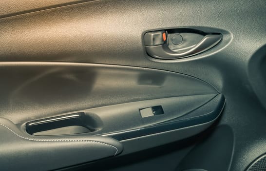 Car Door Handle and Side Mirror Control Switch Inside Car in Vintage Tone