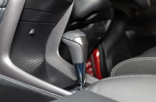 Gray Automatic Gear Handle in Car Interior on Center Frame