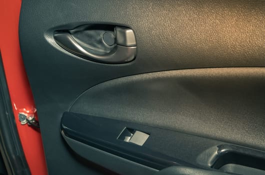 Rear Door Handle and Side Mirror Control Switch of Car in Zoom View in Vintage Tone