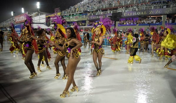 Rio de Janeiro, Brasil-  February 29, 2020: Samba Parade at the 2020 Carnival Champions Parade, Sambodromo. It's raining