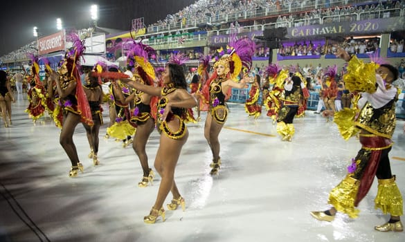 Rio de Janeiro, Brasil-  February 29, 2020: Samba Parade at the 2020 Carnival Champions Parade, Sambodromo. It's raining