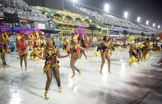 Rio de Janeiro, Brasil-  February 29, 2020: Samba Parade at the 2020 Carnival Champions Parade, Sambodromo. It's raining