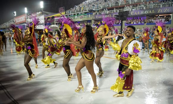Rio de Janeiro, Brasil-  February 29, 2020: Samba Parade at the 2020 Carnival Champions Parade, Sambodromo. It's raining