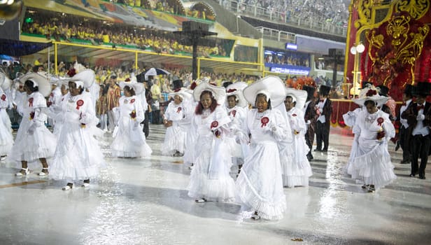 Rio de Janeiro, Brasil-  February 29, 2020: Samba Parade at the 2020 Carnival Champions Parade, Sambodromo. It's raining