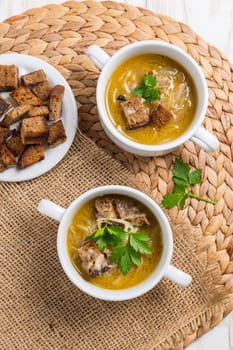 Traditional French onion soup with toasted bread croutons for autumn and winter