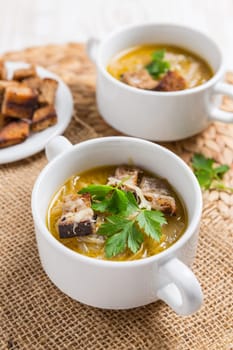 Traditional French onion soup with toasted bread croutons for autumn and winter