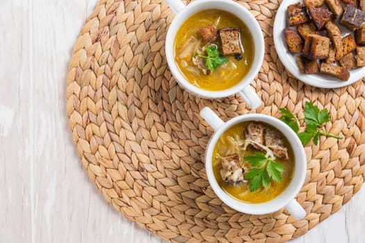 Traditional French onion soup with toasted bread croutons for autumn and winter