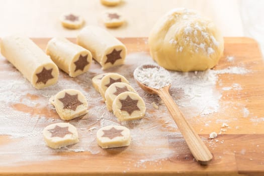 Baking christmas cookies with chocolate star. Homemade bakery, xmas sweet, winter holidays concept.