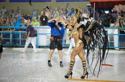 Rio de Janeiro, Brasil-  February 29, 2020: Samba Parade at the 2020 Carnival Champions Parade, Sambodromo. It's raining