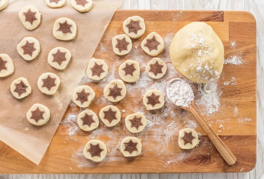 Baking christmas cookies with chocolate star. Homemade bakery, xmas sweet, winter holidays concept.