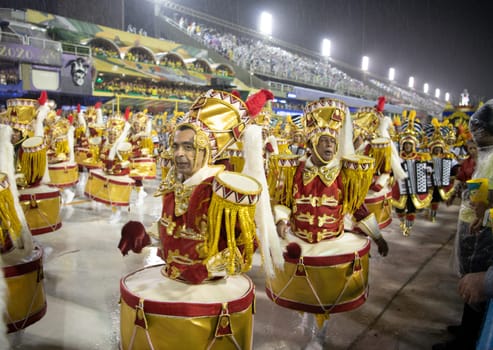 Rio de Janeiro, Brasil-  February 29, 2020: Samba Parade at the 2020 Carnival Champions Parade, Sambodromo. It's raining