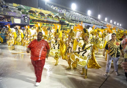 Rio de Janeiro, Brasil-  February 29, 2020: Samba Parade at the 2020 Carnival Champions Parade, Sambodromo. It's raining