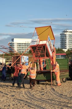 dismantling of a rescue tower on the beach of Swinoujscie in Poland at the end of the bathing season