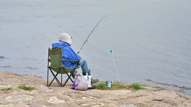 angler on the bank of the Harbour entrance in Swinoujscie on the Polish Baltic coast