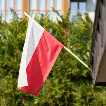 Polish national flag on a house in Swinoujscie in Poland