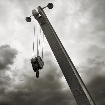 historical old crane with crane hook in Magdeburg harbour