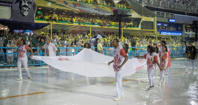 Rio de Janeiro, Brasil-  February 29, 2020: Samba Parade at the 2020 Carnival, Champions Parade, Sambodromo. It's raining