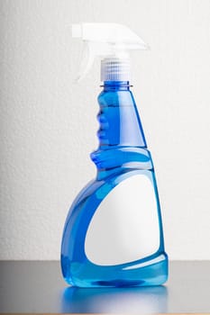 Cleaning liquid bottle in front of  light gray background, editable mock-up series template ready for your design, label selection path included.
