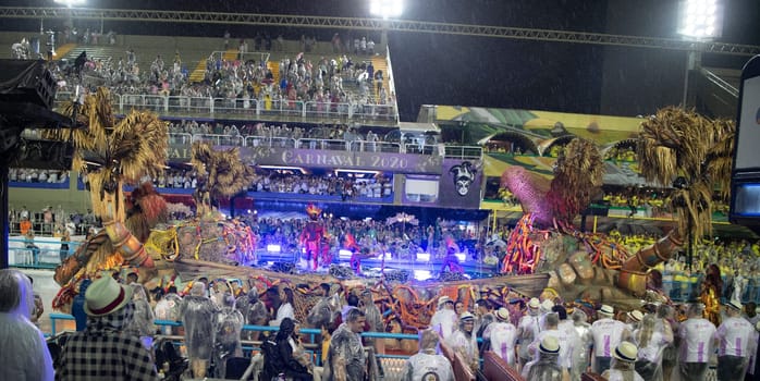 Rio de Janeiro, Brasil-  February 29, 2020: Samba Parade at the 2020 Carnival, Champions Parade, Sambodromo. It's raining