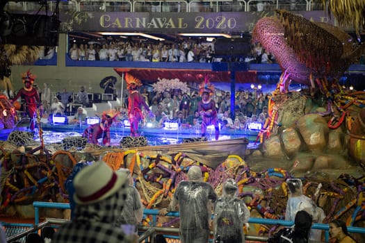 Rio de Janeiro, Brasil-  February 29, 2020: Samba Parade at the 2020 Carnival, Champions Parade, Sambodromo. It's raining
