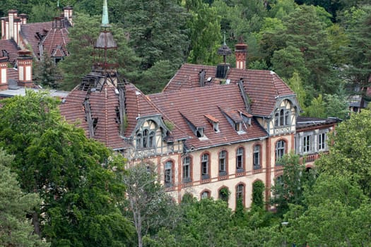 BEELITZ, GERMANY - JUNE 30, 2020: A lost place in germany is the famous abandoned hospital and tuberculosis sanatorium in Beelitz near Berlin. The park is a popular excursion destination.
