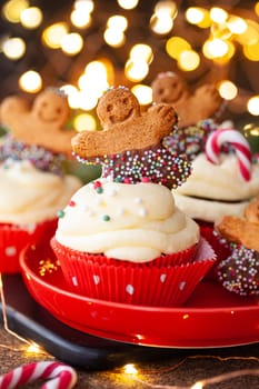 Yummy Cupcakes with butter cream frosting and gingerbread cookies for Christmas