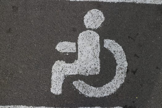 person in a wheelchair road sign close-up