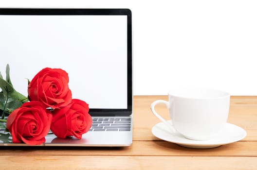 Red rose and coffee cup with laptop mockup on white background, Valentine concept