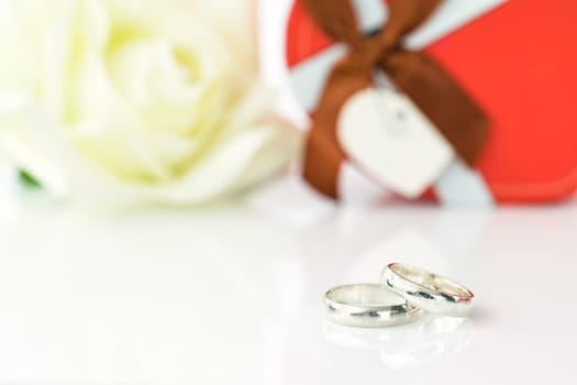 White rose and heart-shaped box on white background, Valentine'sDay concept