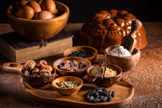 Different baking ingredients, spices and kitchen utensils in vintage style. Christmas baking concept.