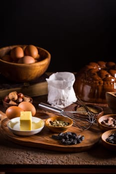 Different baking ingredients, spices and kitchen utensils in vintage style. Christmas baking concept.