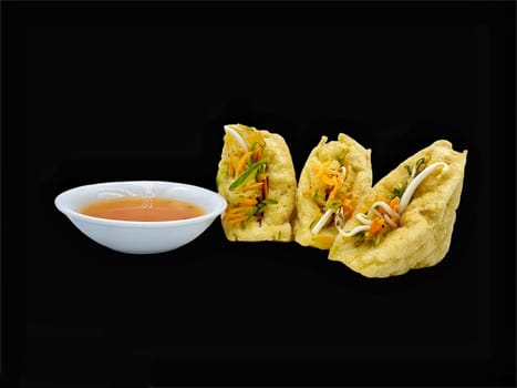 Malay cuisine or Stuffed Tofu called Tauhu sumbat on black background