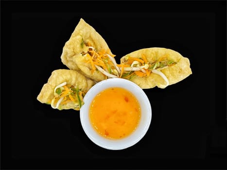 Malay cuisine or Stuffed Tofu called Tauhu sumbat on black background