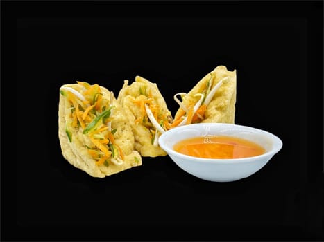 Malay cuisine or Stuffed Tofu called Tauhu sumbat on black background
